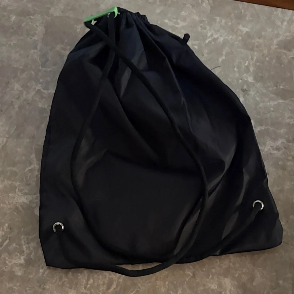 Black Backpack with Green Logo